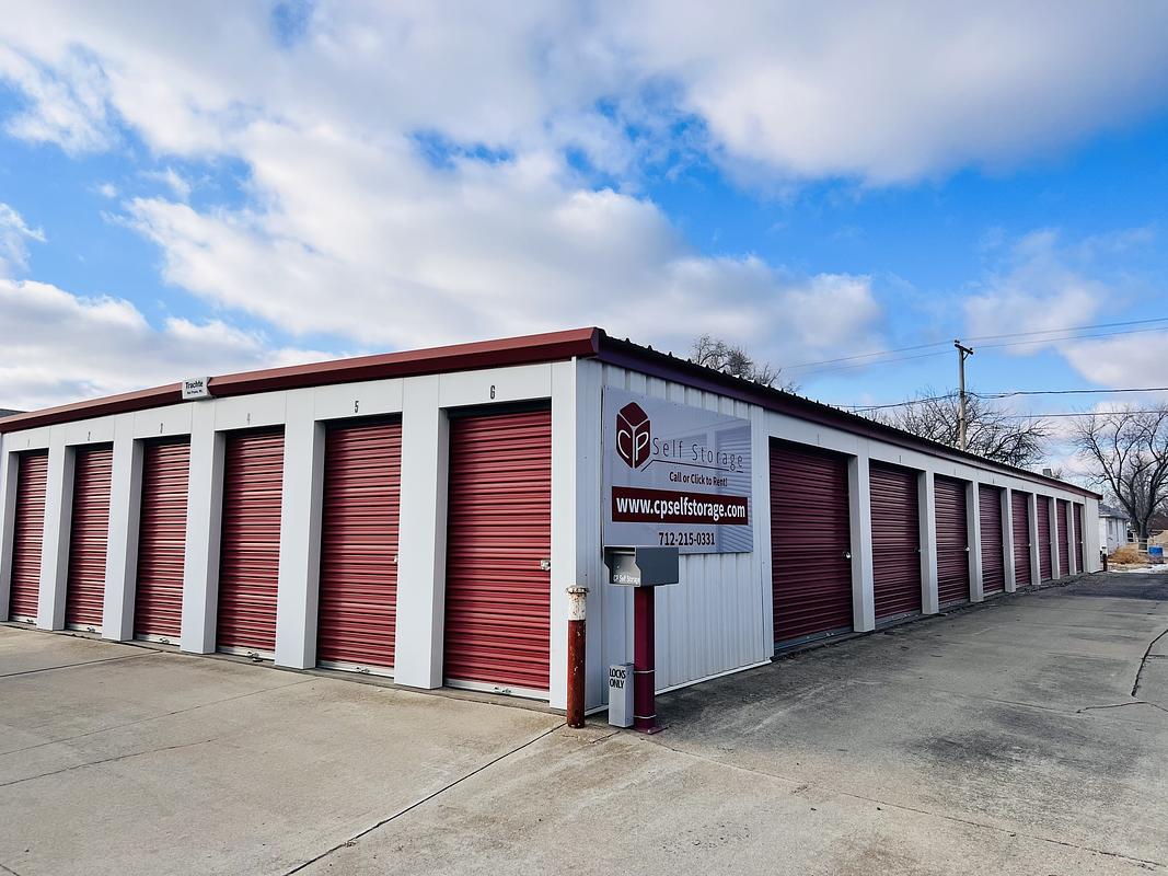 Red roll-up storage unit doors and CP Self Storage sign