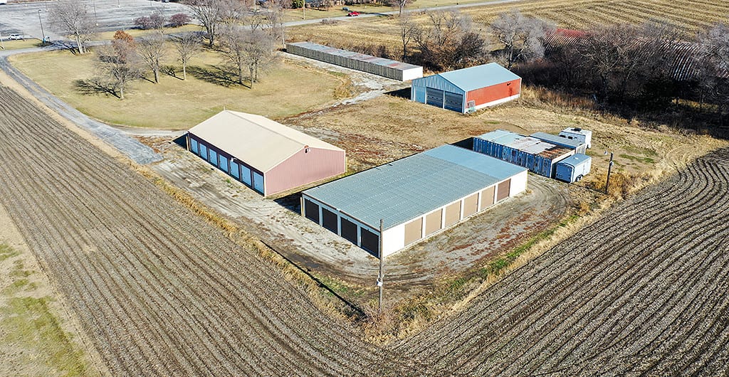 Aerial view of a storage facility surrounded by farm fields